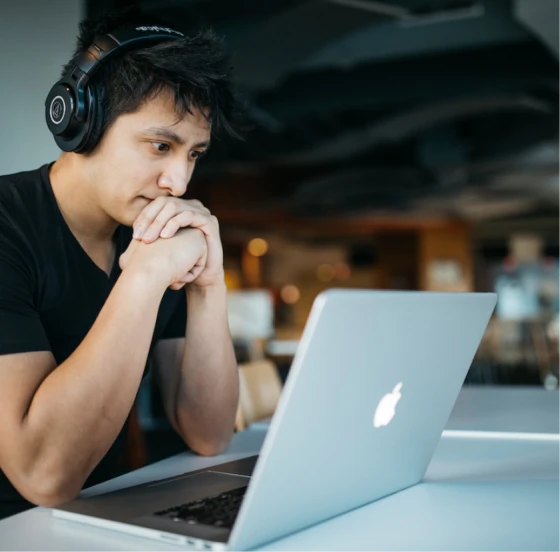 Woman on laptop cheering