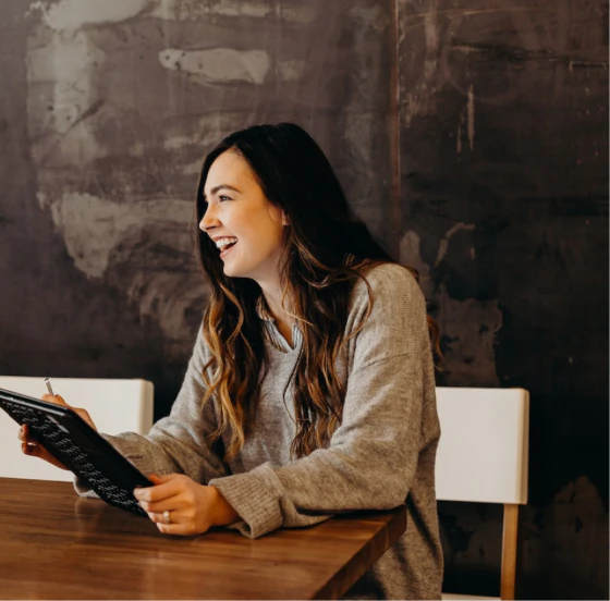 Woman on laptop cheering