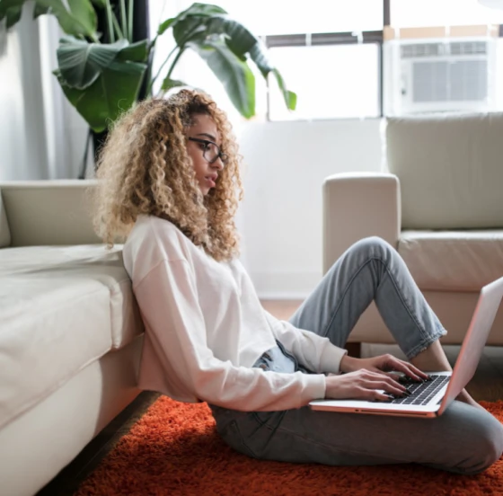 Woman on laptop cheering